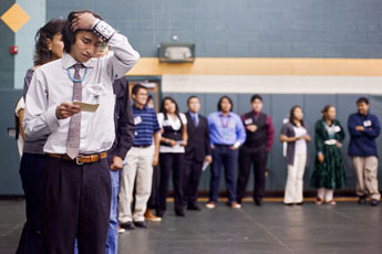 Chief Manuelito Scholarship recipient Emanuel Aguirre fixes his hair and checks his notes before introducing himself to the audience during the scholarship awards ceremony at Tuba City High School Friday. About 60 students received the scholarship and all were given the chance to speak at the ceremony. © 2011 Gallup Independent / Cable Hoover 